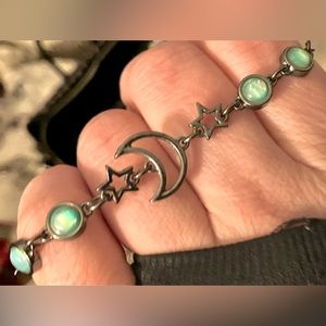 Beautiful black silver bracelet with crescent moon, stars and irridescent